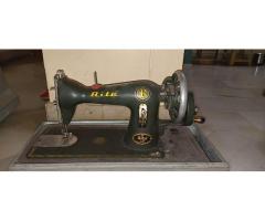 Sewing machine with hand